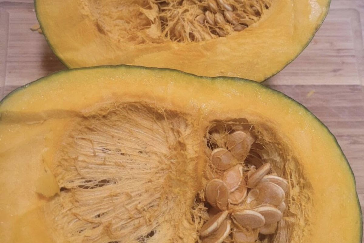 a cut up pumpkin on a cutting board